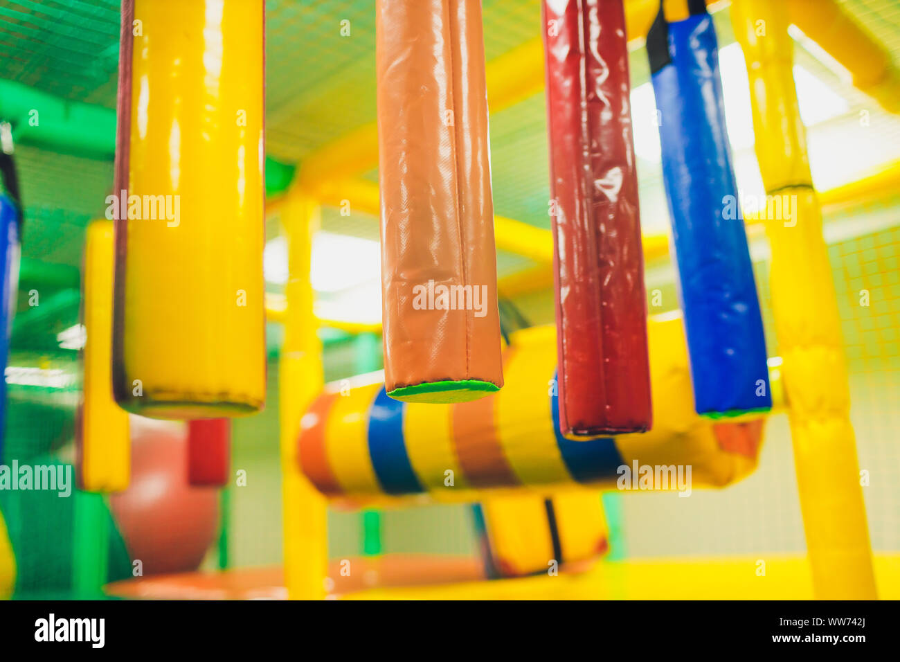Modern playground indoor. Kids jungle in a play room. Round tunnel in