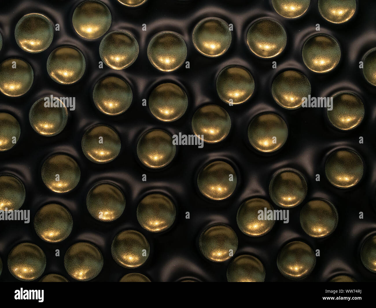 Bronze bubbles on black plastic background Stock Photo
