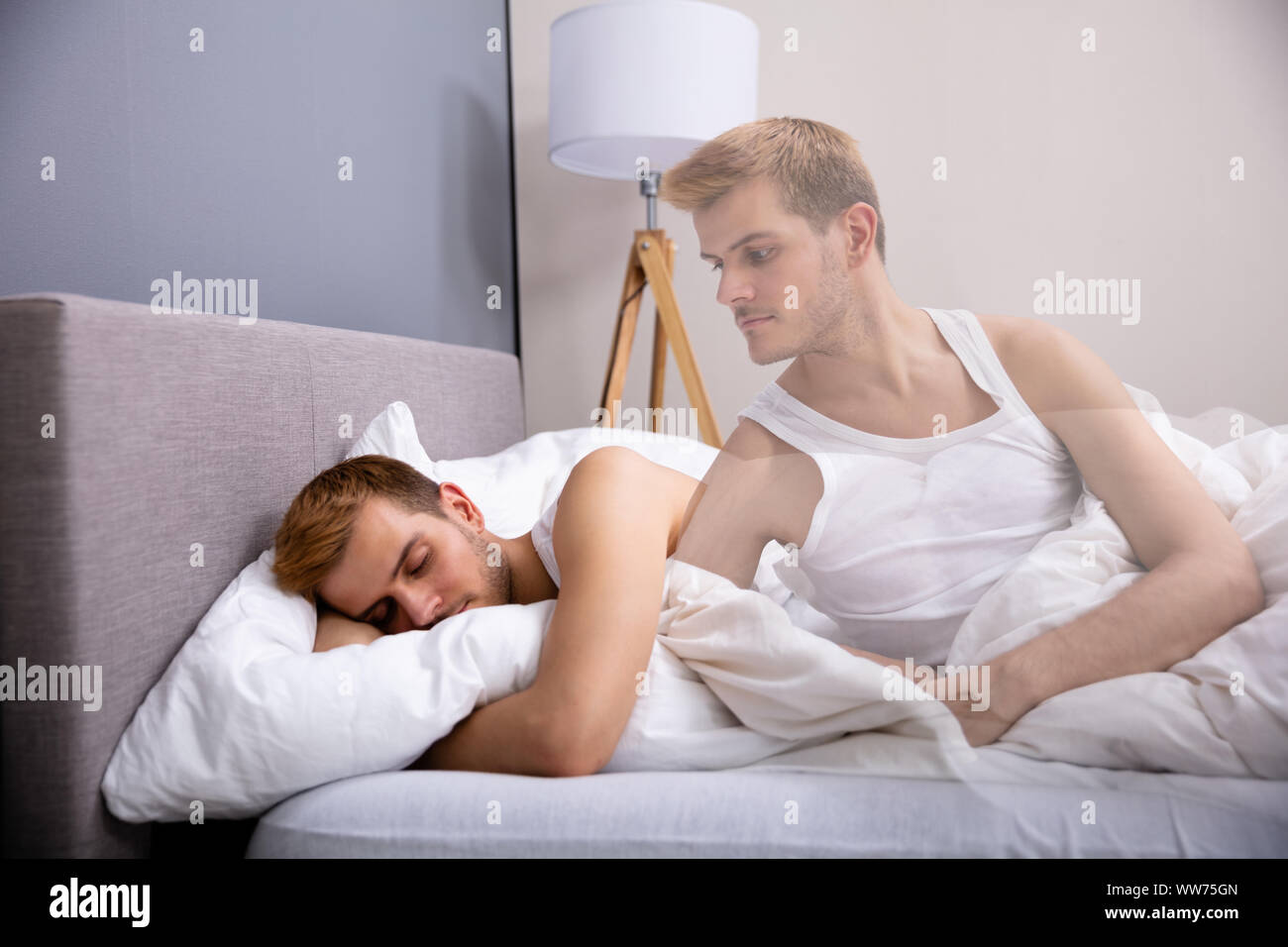 Soul Leaves Young Man Body While Sleeping In Bed Stock Photo
