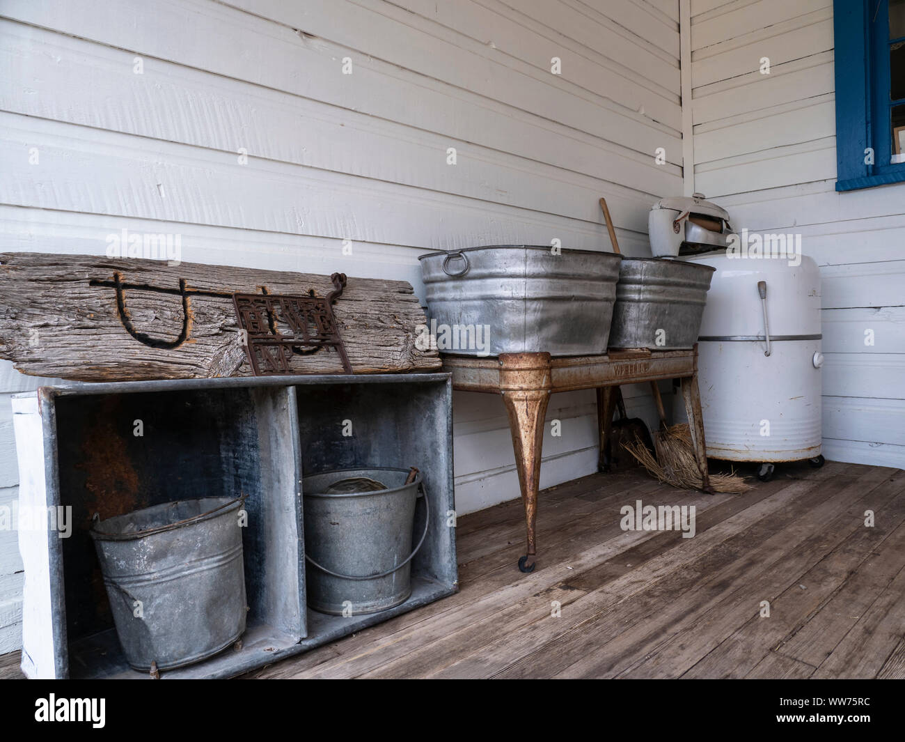 Old wringer washer, front porch of main house, Swett Ranch National Historic site, Flaming Gorge National Recreation Area near Dutch John, Utah. Stock Photo