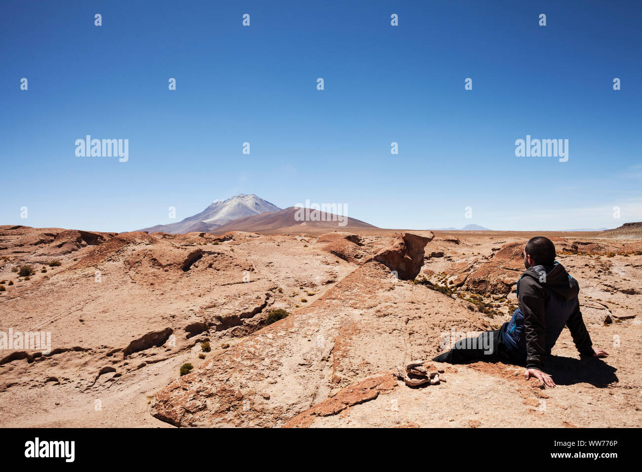 Bolivia, man in Eduardo Abaroa Andean Fauna National Reserve, volcano Stock Photo