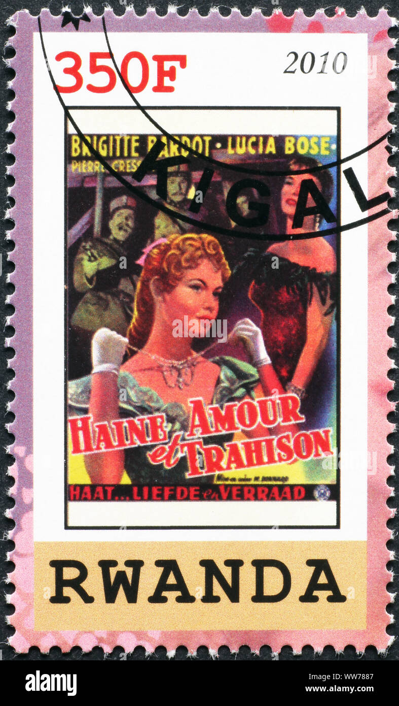 Old poster of movie with Brigitte Bardot on stamp Stock Photo