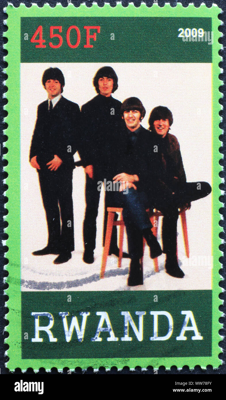 The Fab Four on postage stamp of Rwanda Stock Photo