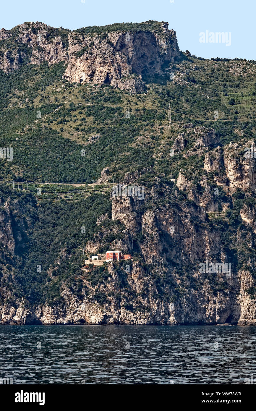 Amalfi Coast, Tyrrhenian Sea, rocky cliff, vegetation, house, water, seclusion, Europe; Italy; spring; vertical Stock Photo