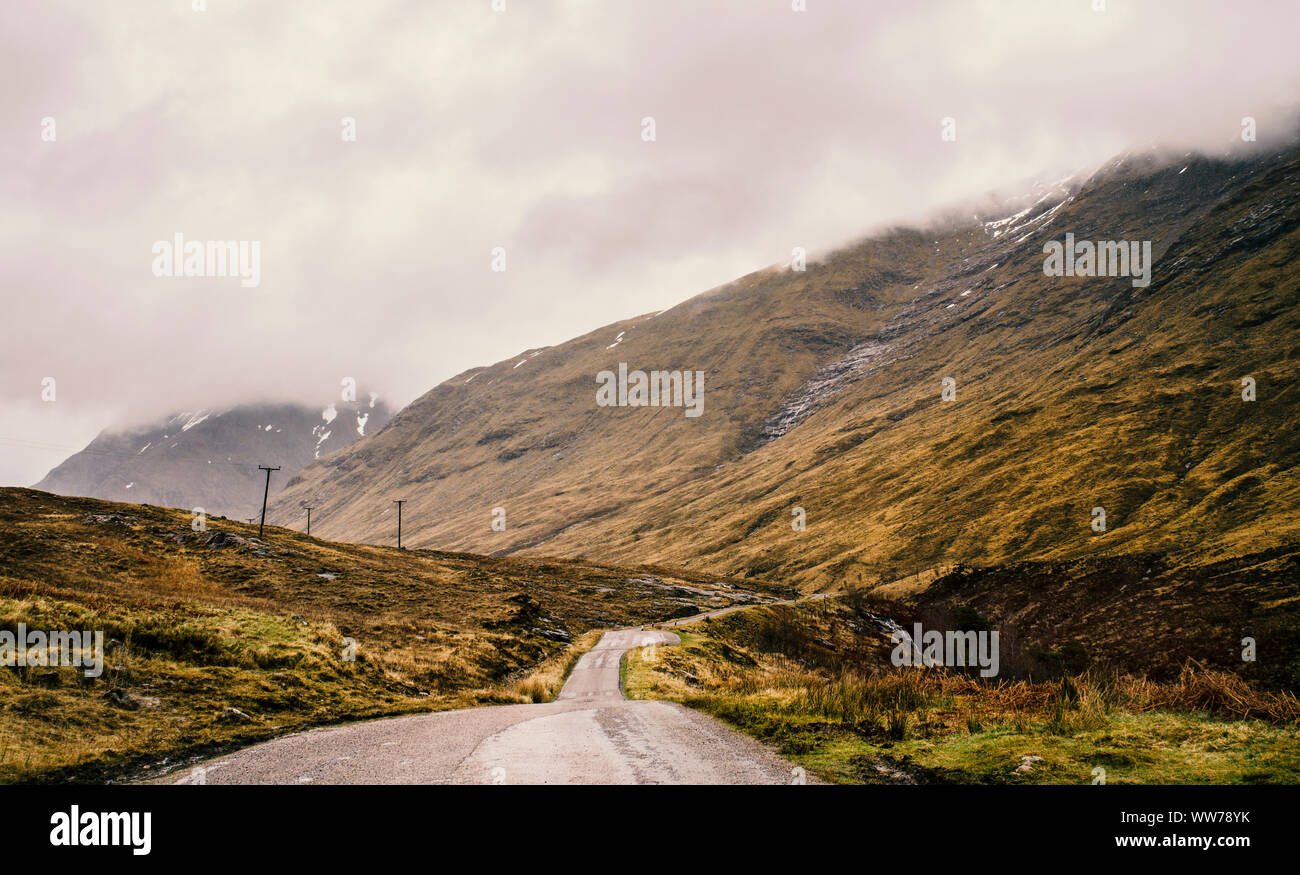 Country road, Glen Coe Valley, Highlands, Scotland Stock Photo