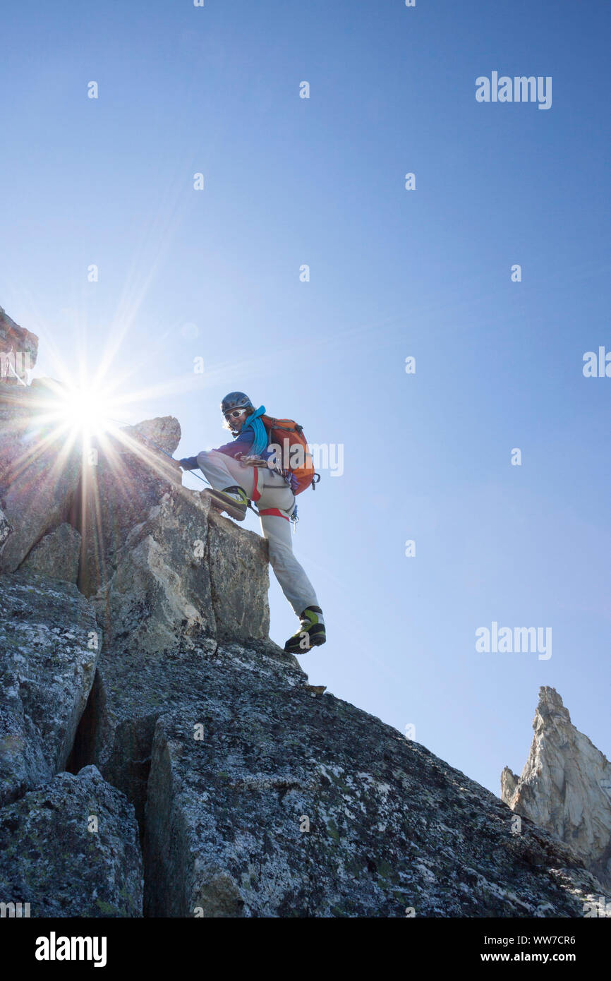 Climber climbing the summit of Dent de Tsalion via Arolla, Val d'HÃ©rens, Valais, Switzerland Stock Photo