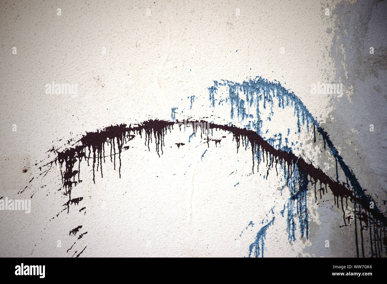 Close up of house wall with paint splashes repair spots hires stock