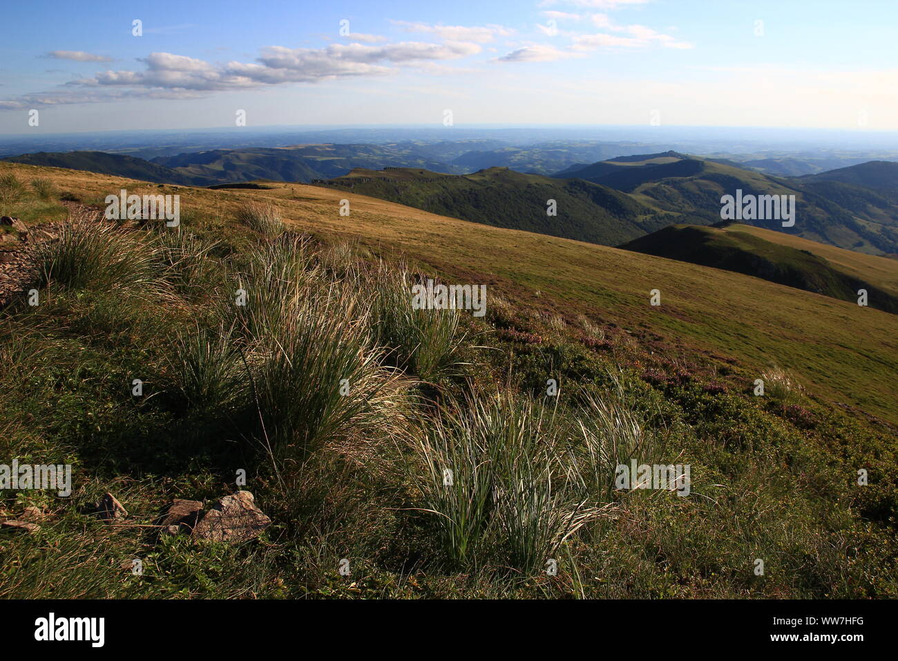 Early summer evening and wide view from Puy Chavaroche (Cantal, Auvergne region, France) Stock Photo