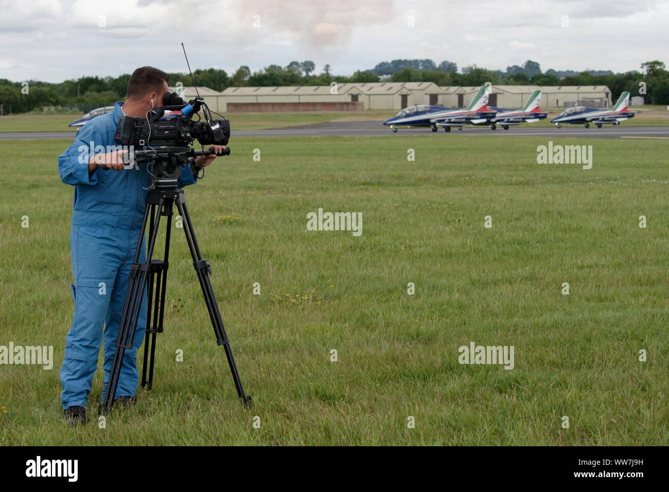 Video Cameraman from the Italian Air Force Frecce Tricolori Records the military aerobatic display team's performance at the RIAT Stock Photo
