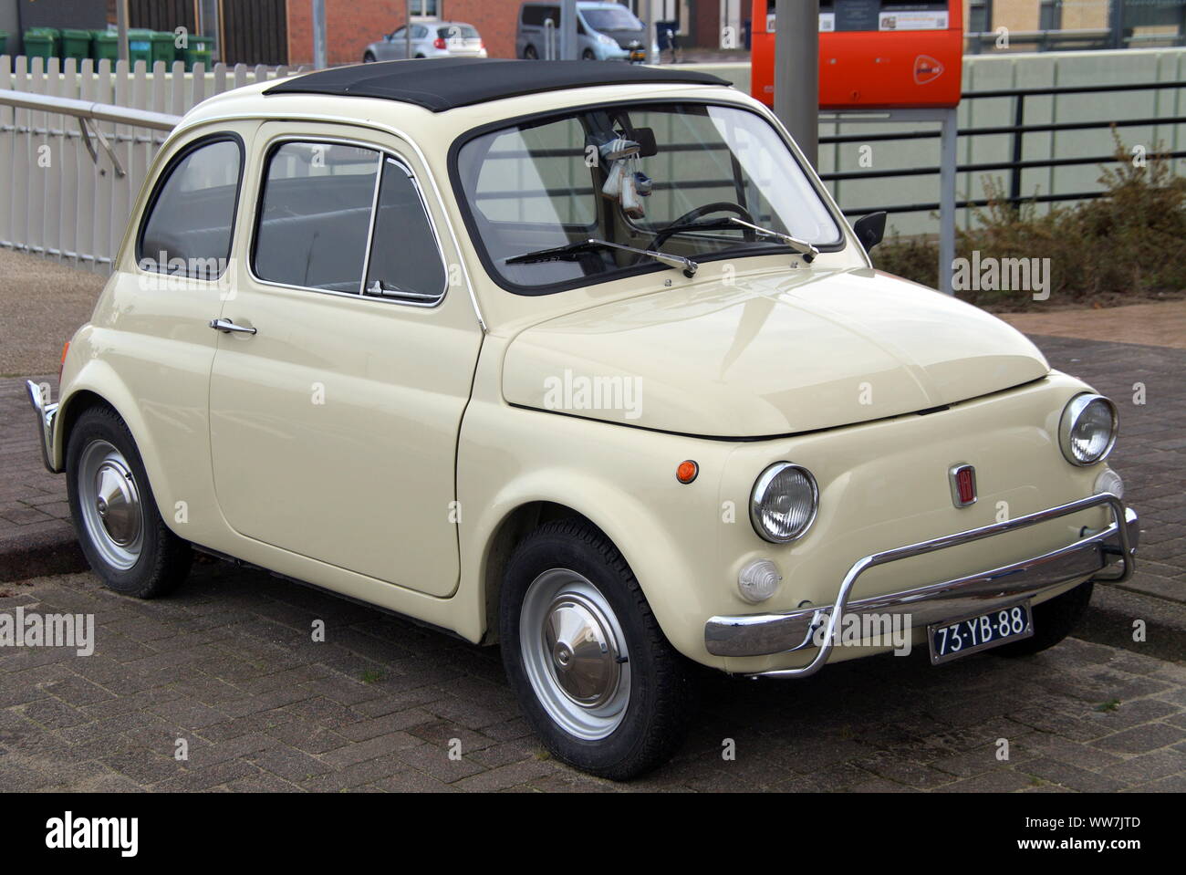 Almere, Flevoland, The Netherlands - November 14, 2014: Beige Fiat 500 parked in a public parking lot. Stock Photo