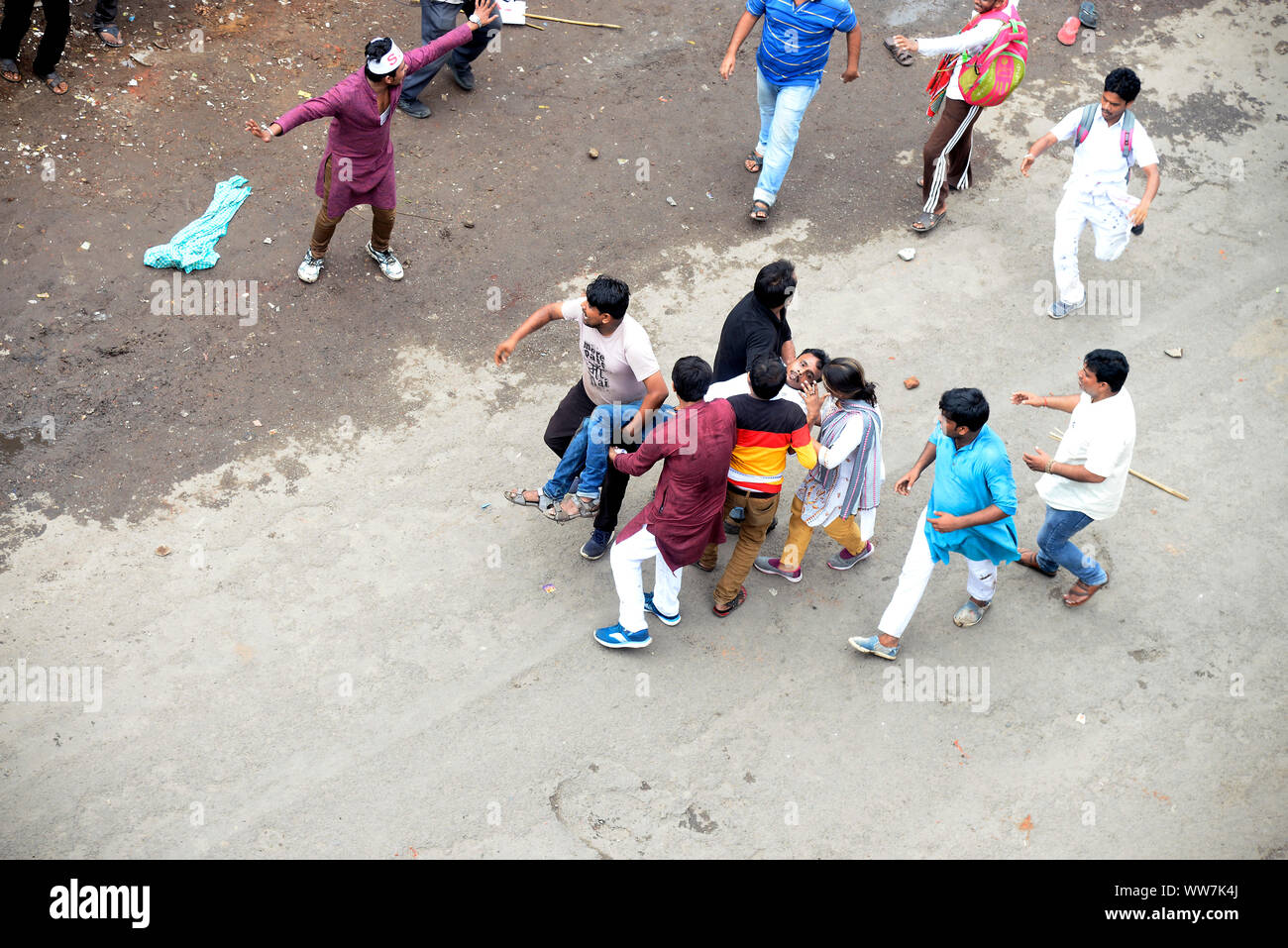 Kolkata, India. 13th Sep, 2019. Left activist carry their injured members during Left parties youth and student activist take part in Singur to Nanabbana rally demanding jobs opportunity. (Photo by Saikat Paul/Pacific Press) Credit: Pacific Press Agency/Alamy Live News Stock Photo
