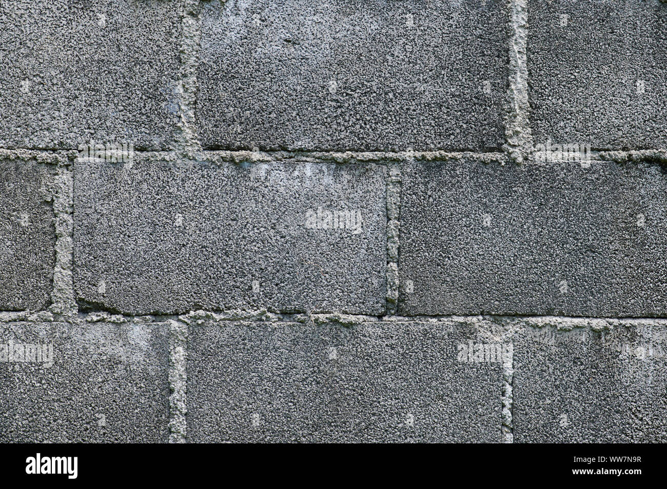 Grey brick solid wall pattern background close up view Stock Photo
