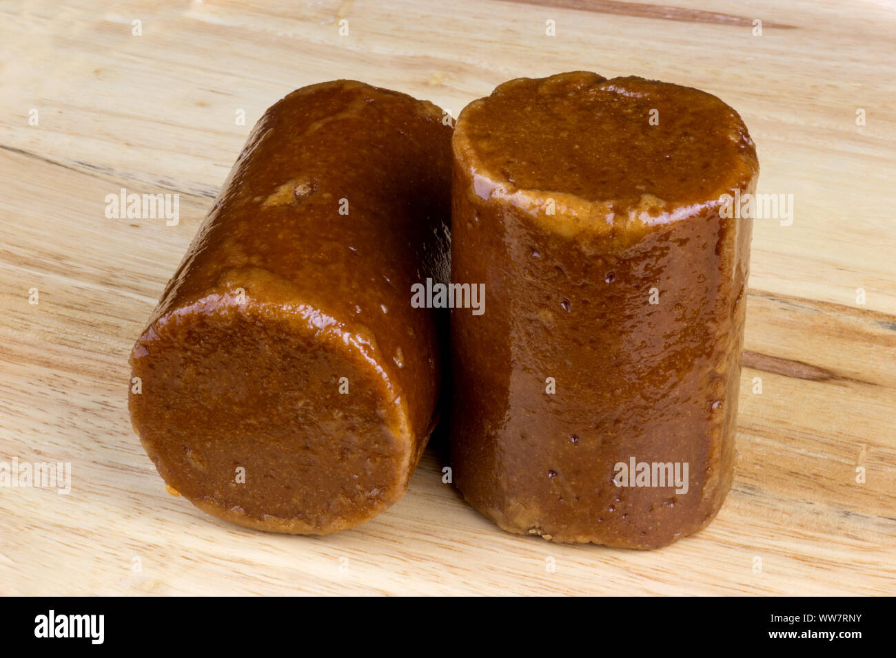 Malaysian palm sugar or Gula Melaka on a wooden surface Stock Photo