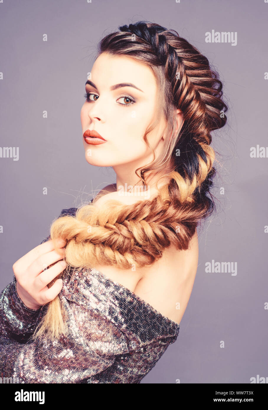 Braided hairstyle. Beautiful young woman with modern hairstyle. Beauty  salon hairdresser art. Girl makeup face braided long hair. French braid.  Professional hair care and creating hairstyle Stock Photo - Alamy
