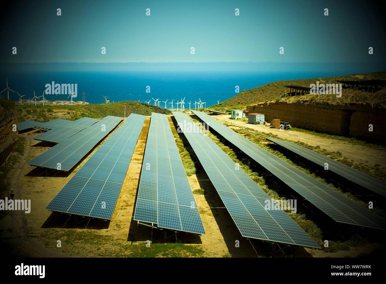 solar panel and windmill farm production in the nature in tenerife canary islands. creating a new world for a green future for the people Stock Photo