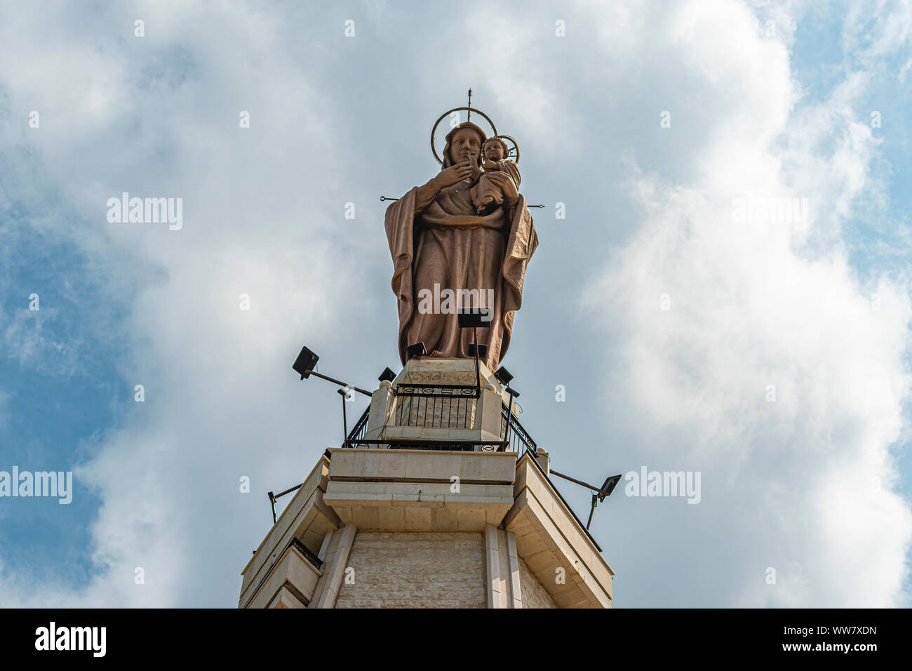 Virgin Mary statue on the top of the mountain. Virgin Mary statue