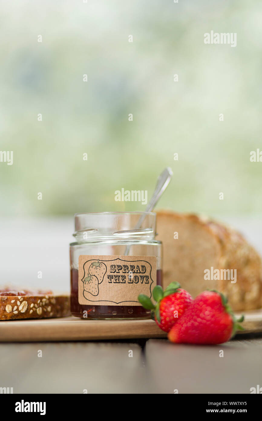 Strawberry jam, preserving jar, serving tray Stock Photo