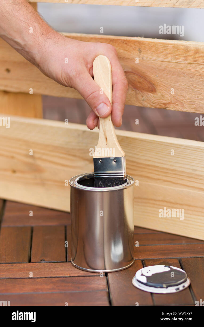 Self-built herb garden, brush, paint, paint tin Stock Photo