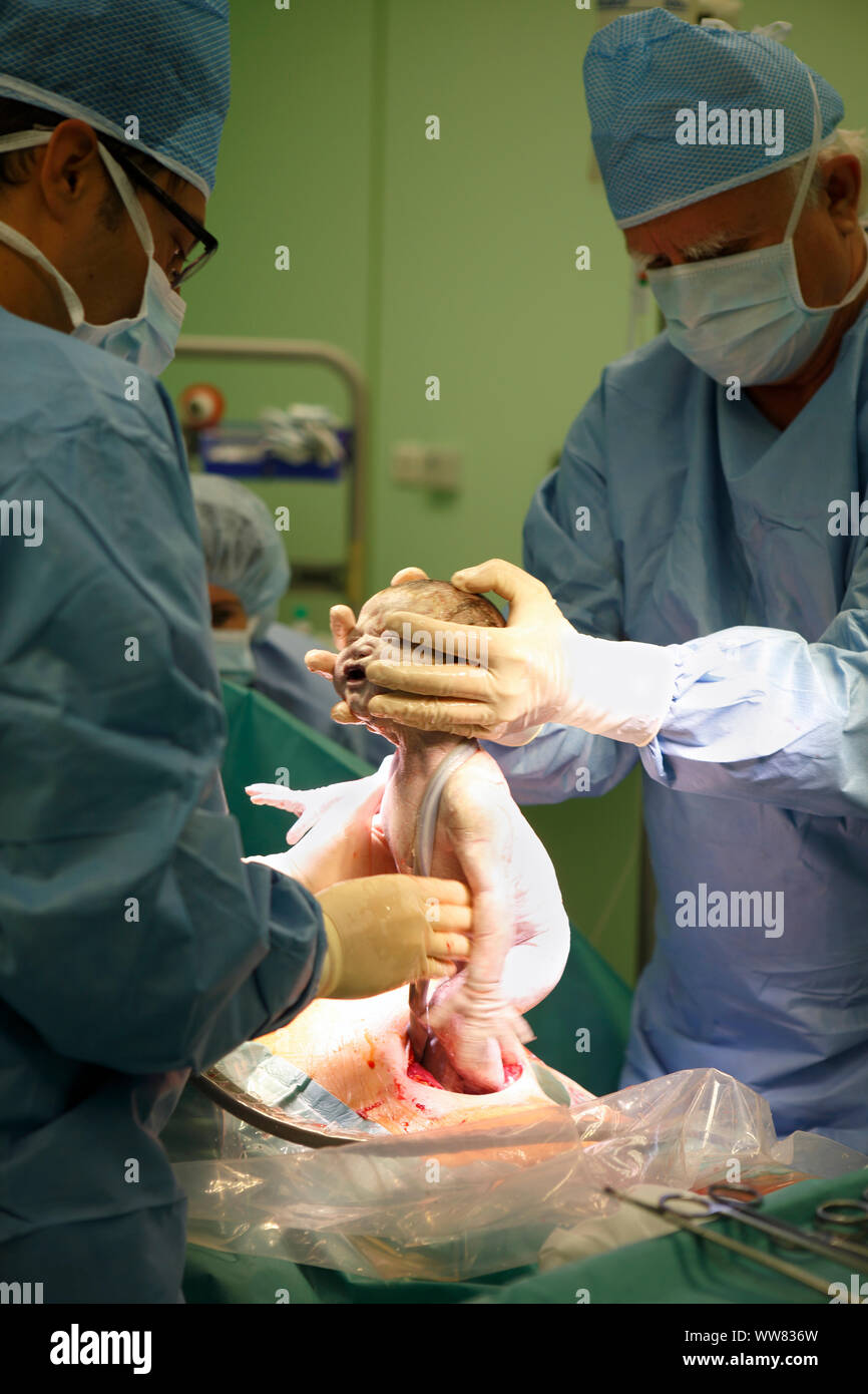 Newborn child, doctors, operation, birth, Caesarean section, surgery department, health service, hospital, Czechia Stock Photo