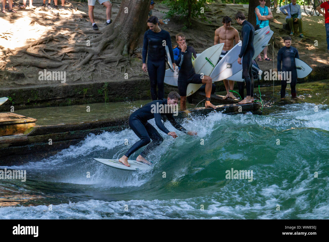 River Wave surfing on the Eisbach, which flows through Englischer