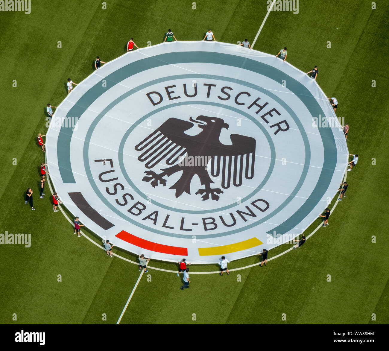 Aerial view, youth players practicing on the adjacent field the unrolling of the emblem of the German Football Association, Stadium Niederrhein, Stadium SC Rot-Weiss Oberhausen e.V., training courts, between Emscher and Rhein-Herne Canal, Oberhausen, Ruhr area, North Rhine-Westphalia, Germany Stock Photo