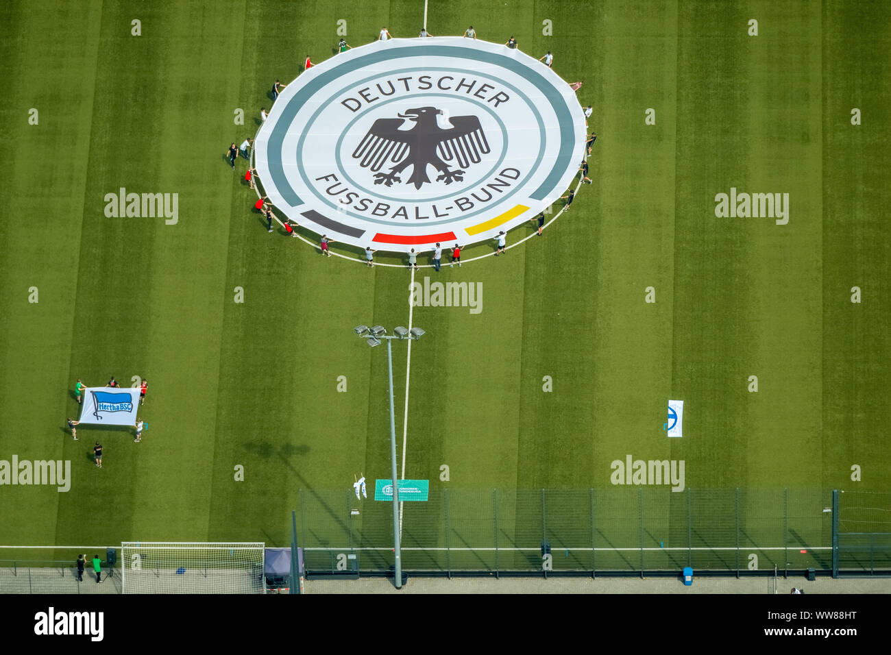 Aerial view, youth players practicing on the adjacent field the unrolling of the emblem of the German Football Association, Stadium Niederrhein, Stadium SC Rot-Weiss Oberhausen e.V., training courts, between Emscher and Rhein-Herne Canal, Oberhausen, Ruhr area, North Rhine-Westphalia, Germany Stock Photo