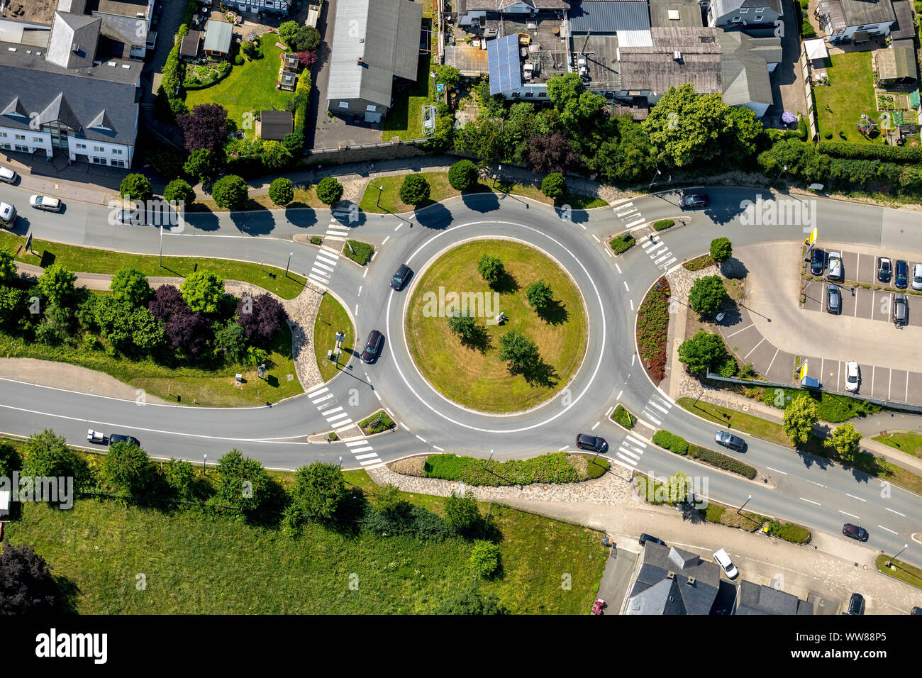 Aerial view, roundabout near train station with sculpture 'Lesendes Paar', Schmallenberg, Sauerland, North Rhine-Westphalia, Germany Stock Photo