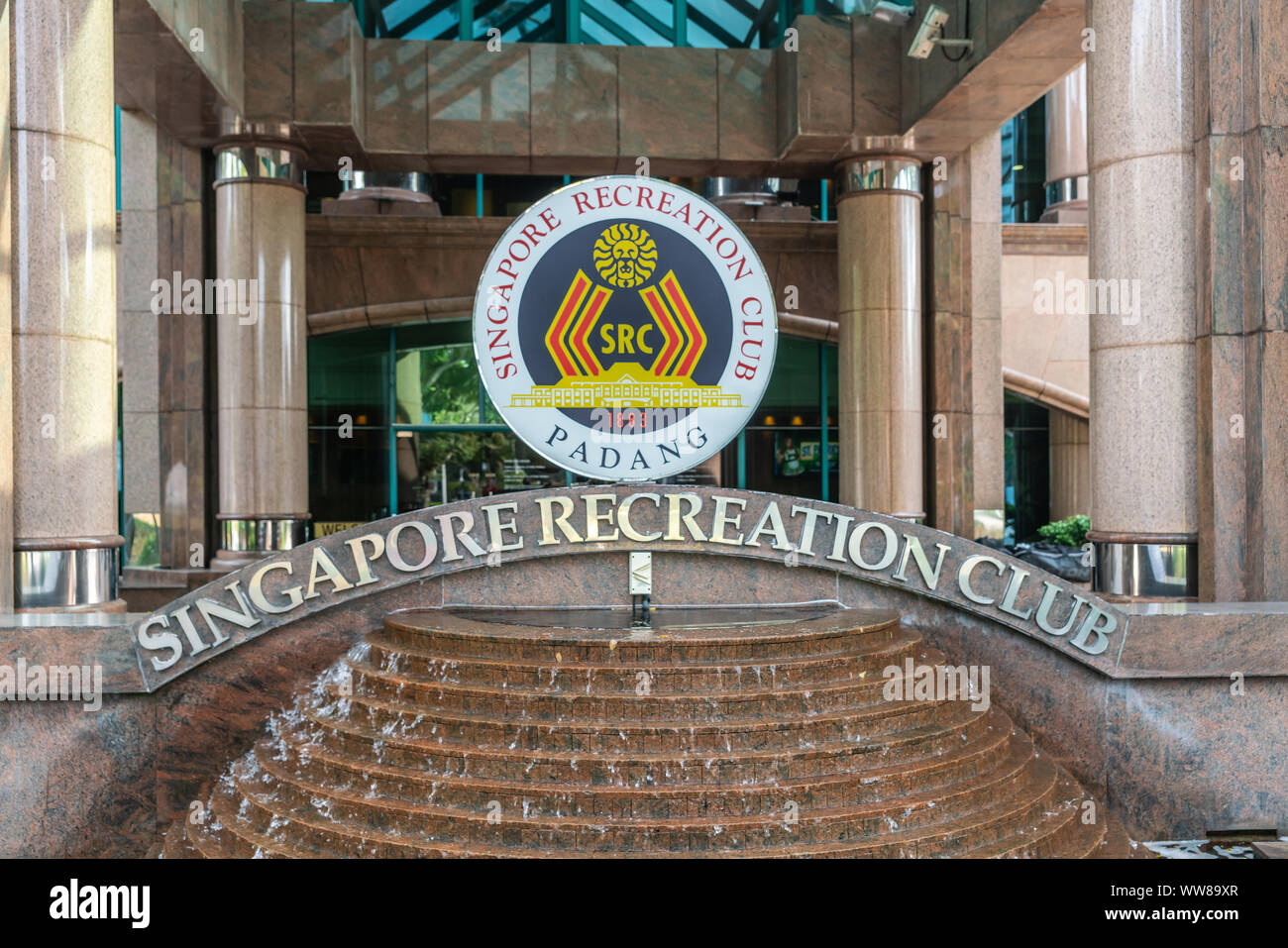 Singapore - March 20, 2019: Closeup of sign standing on fountain at entrance of Singapore Recreation Club, called Padang with its Cricket Club among o Stock Photo