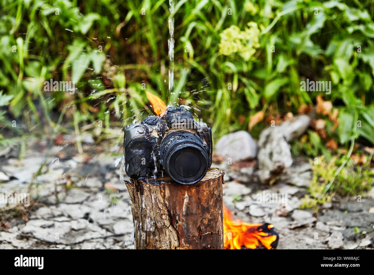 The camera left near the fire was charred and melted. The camera was burned  from the flames of a tourist campfire, and fell into disrepair. A photogra  Stock Photo - Alamy