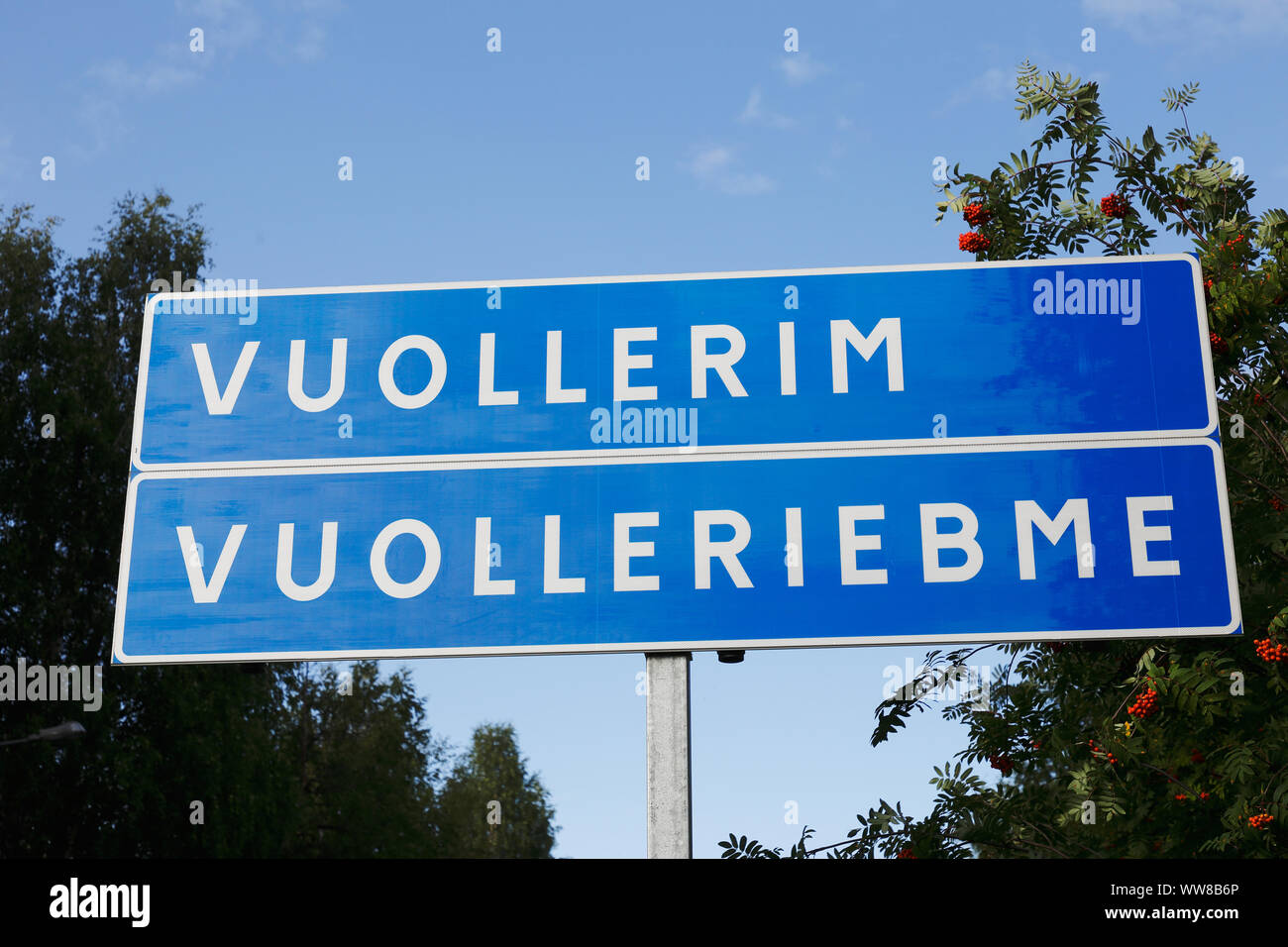 Bilingual road sign for the Swedish village Vuallerim in Swedish and Sami. Stock Photo