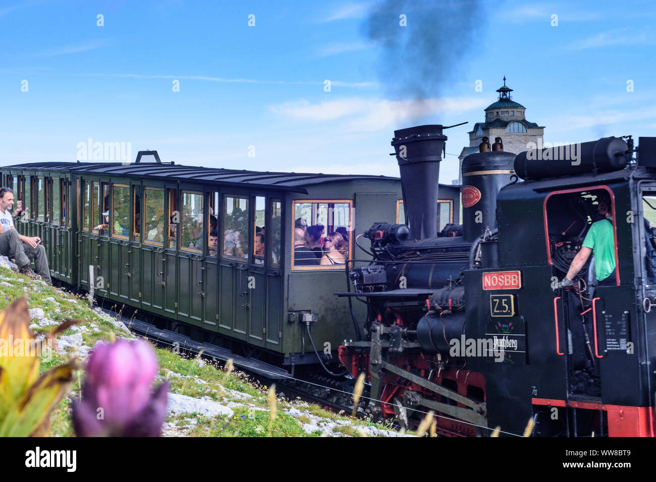 Puchberg am Schneeberg, mountain Schneeberg, steam train of Schneebergbahn (Schneeberg Railway), Kaiserin-Elisabeth-GedÃ¤chtniskirche (Empress Elisabeth Memorial Church), flower, Wiener Alpen (Vienna Alps), Alps, Lower Austria, Austria Stock Photo