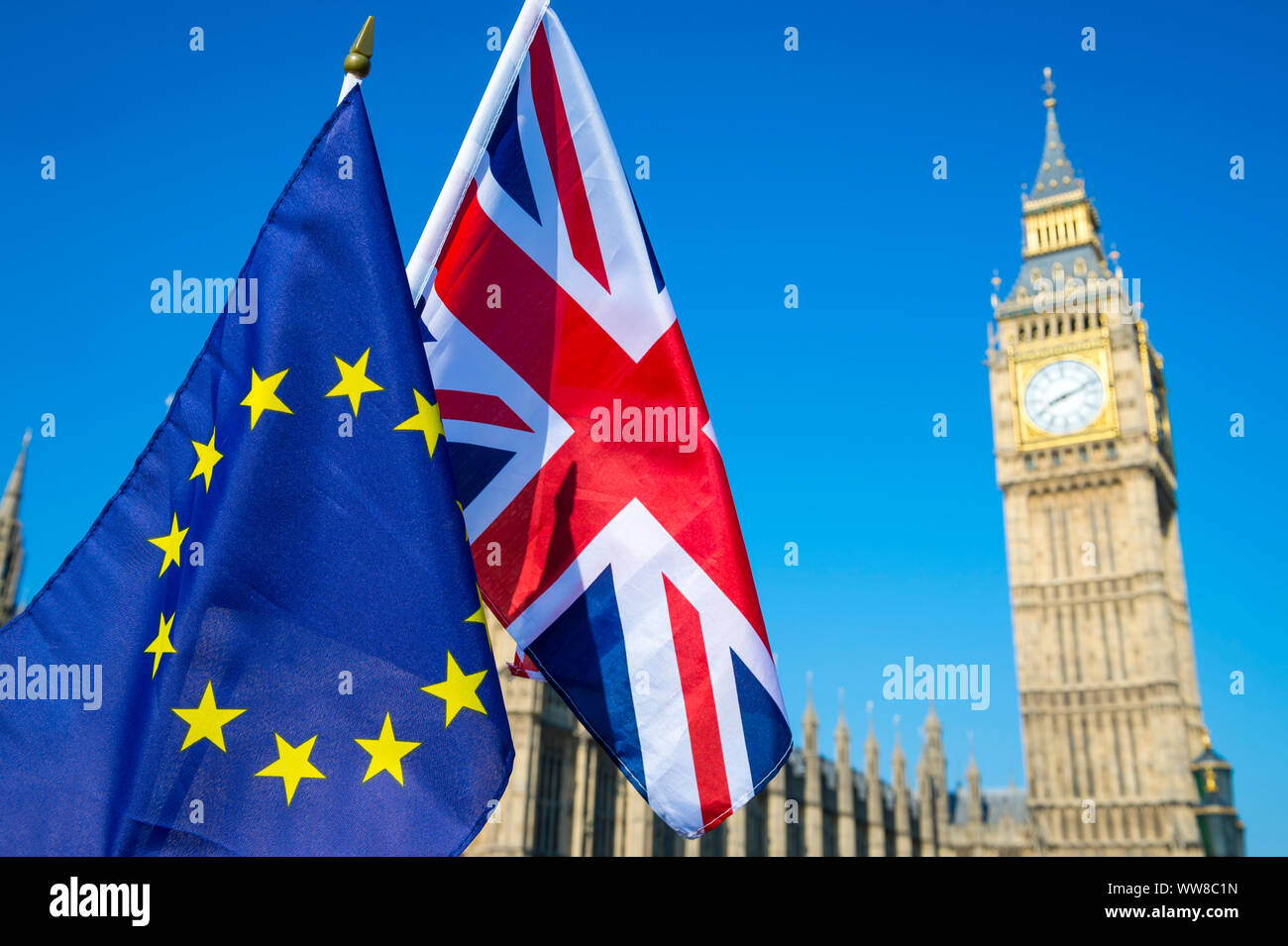 European Union and British Union Jack flag hanging at Big Ben and the Houses of Parliament at Westminster Palace, London, in preparation for Brexit Stock Photo