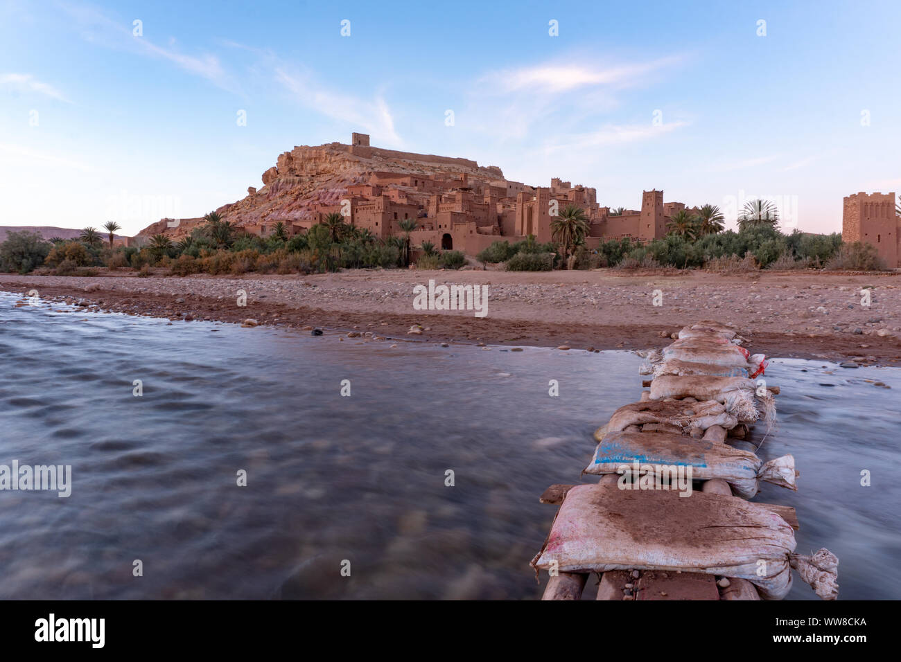 The fortified town of Ait ben Haddou near Ouarzazate on the edge of the sahara desert in Morocco. With river on foreground. Atlas mountains Stock Photo