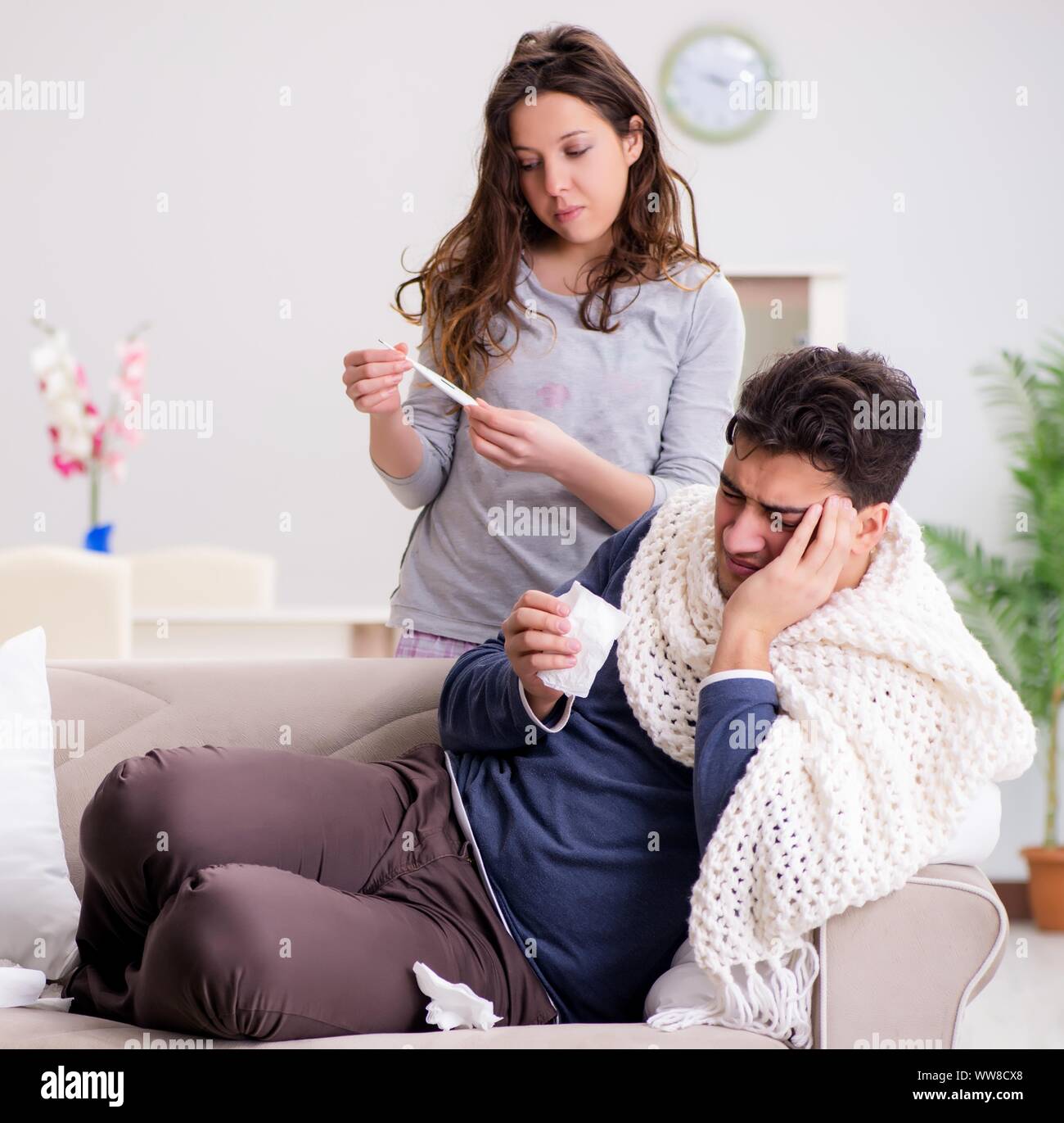 The wife caring for sick husband at home Stock Photo - Alamy