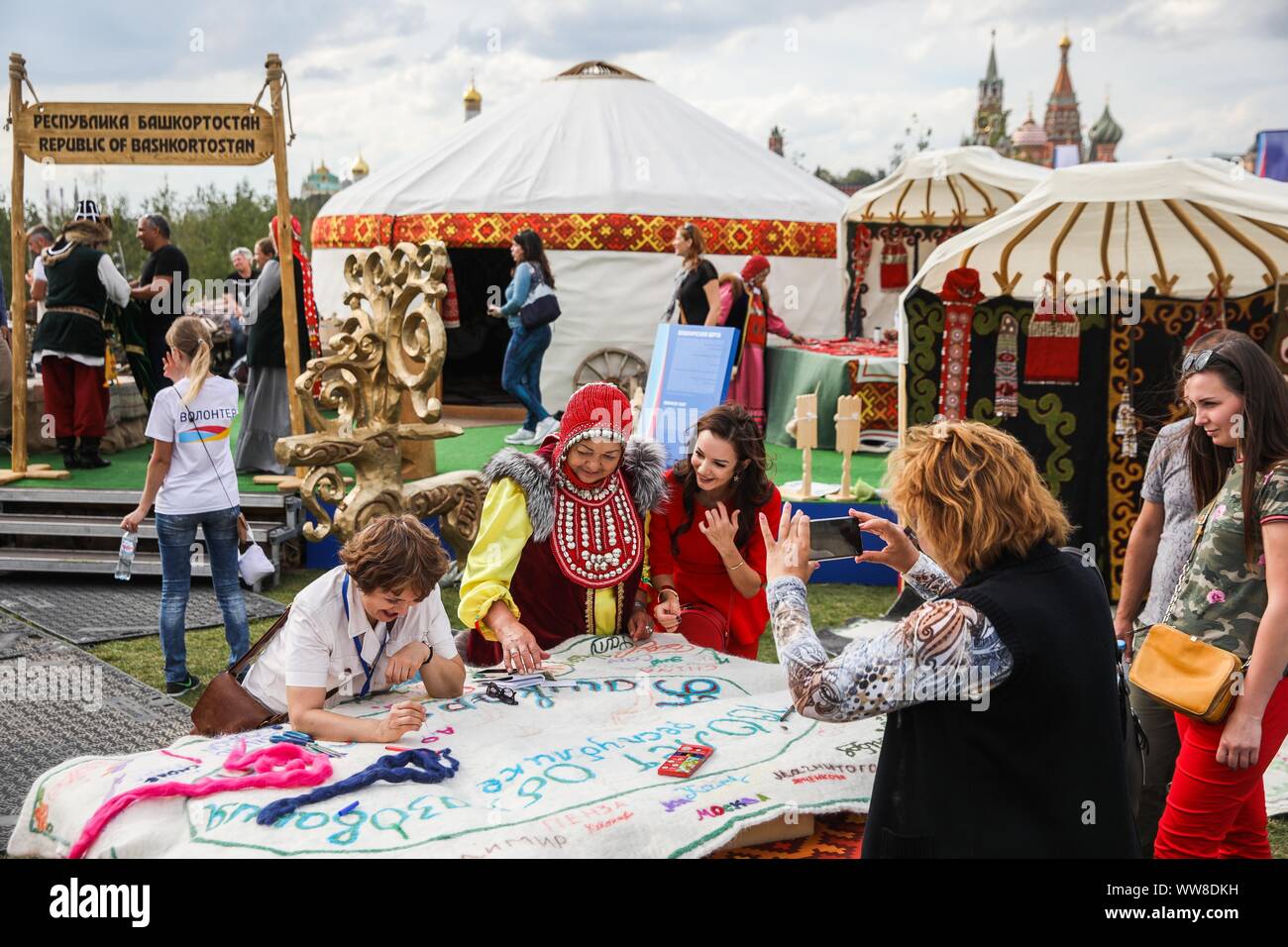 Moscow, Russia. 13th Sep, 2019. People participate in a masterclass at the site of Bashkortostan Republic during the Russian Geographical Society Festival at Zaryadye park in Moscow, Russia, on Sept. 13, 2019. The 4th Russian Geographical Society Festival is held from Sept. 13 to Sept. 22 in Moscow. Visitors will be able to get acquainted with the diverse nature and cultural heritage of Russia during the festival. Credit: Maxim Chernavsky/Xinhua Stock Photo
