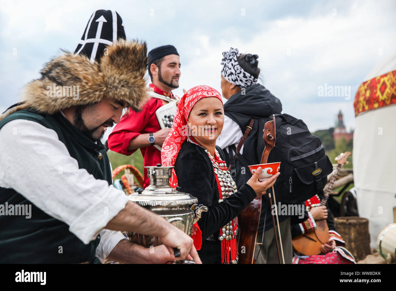 Moscow, Russia. 13th Sep, 2019. Representatives of Bashkortostan Republic show a traditional tea ceremony at their site during the Russian Geographical Society Festival at Zaryadye park in Moscow, Russia, on Sept. 13, 2019. The 4th Russian Geographical Society Festival is held from Sept. 13 to Sept. 22 in Moscow. Visitors will be able to get acquainted with the diverse nature and cultural heritage of Russia during the festival. Credit: Maxim Chernavsky/Xinhua Stock Photo