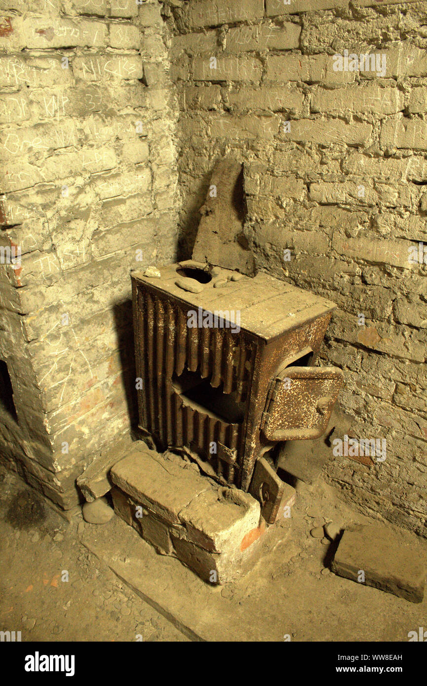 Abandoned iron fire in Auschwitz Birkenau crematorium. Stock Photo