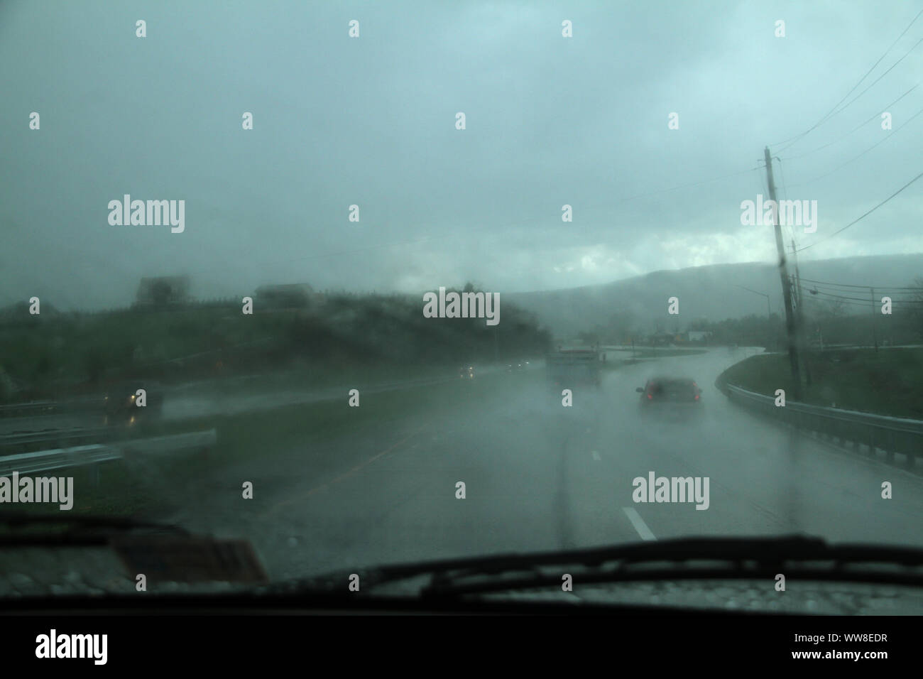 Driving in heavy rain conditions hires stock photography and images