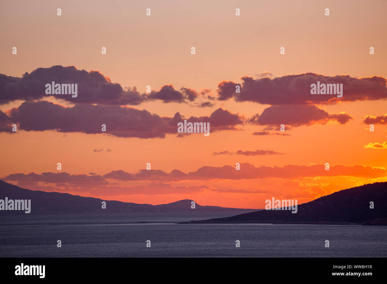 Sunset above Black island (Turkey) and Kos (Greece) to the left, Seen from 20km southeast of Bodrum, Turkey, Stock Photo