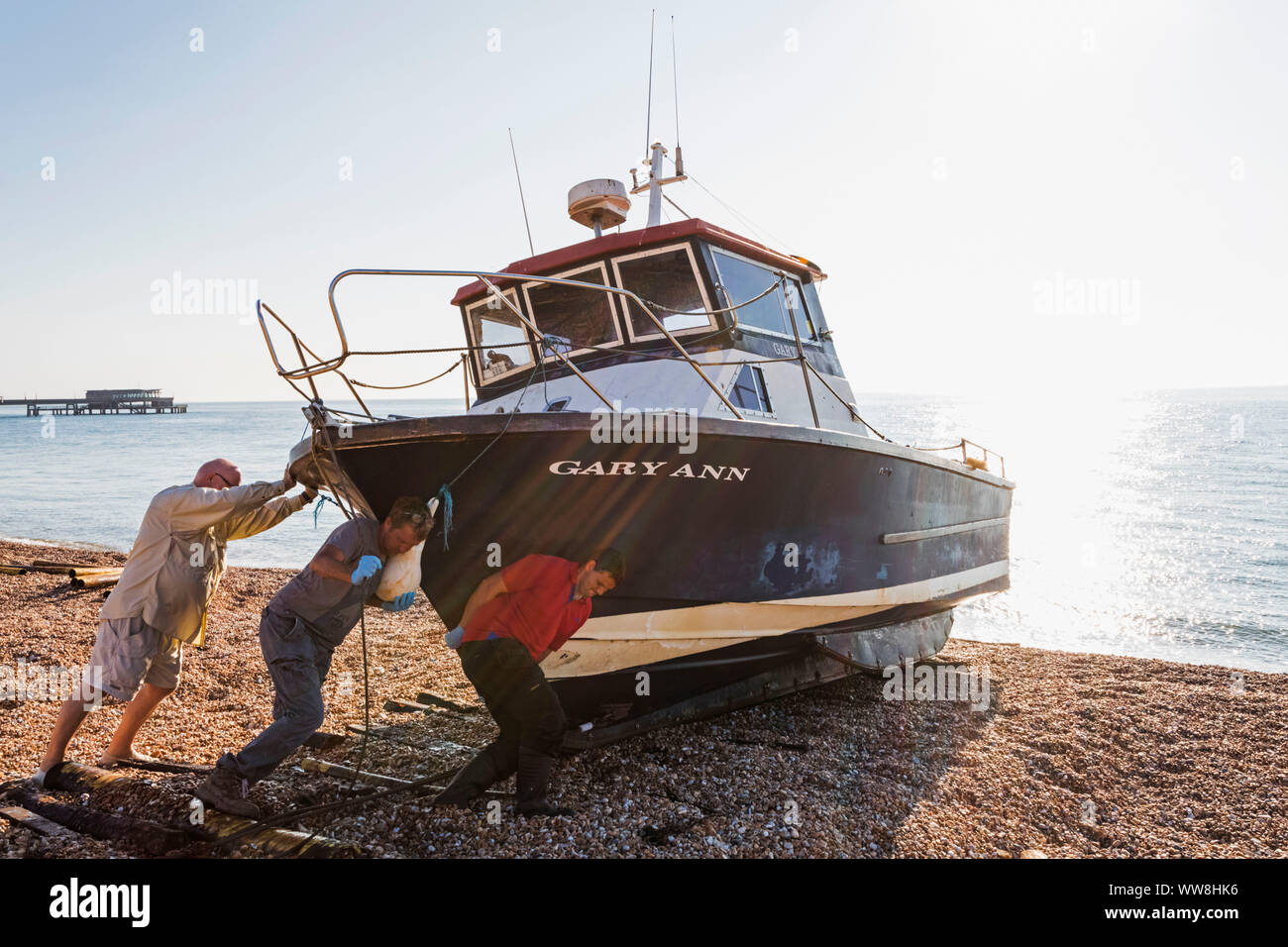England, Kent, Deal, Fisherman Launching Fishing Boat Stock Photo