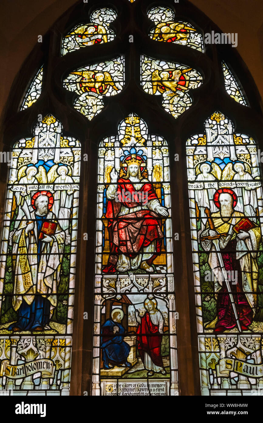 England, East Sussex, Rye, The Parish Church of St.Mary, Stained Glass Window depicting Jesus Christ in Majesty with St.Bartholomew and St.Paul Stock Photo