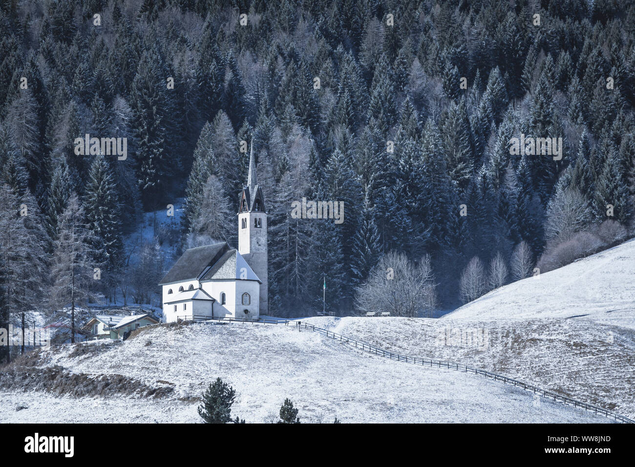 Blessed Virgin of Health church in winter, Caviola, municipality of Falcade, Belluno, Veneto, Italy Stock Photo