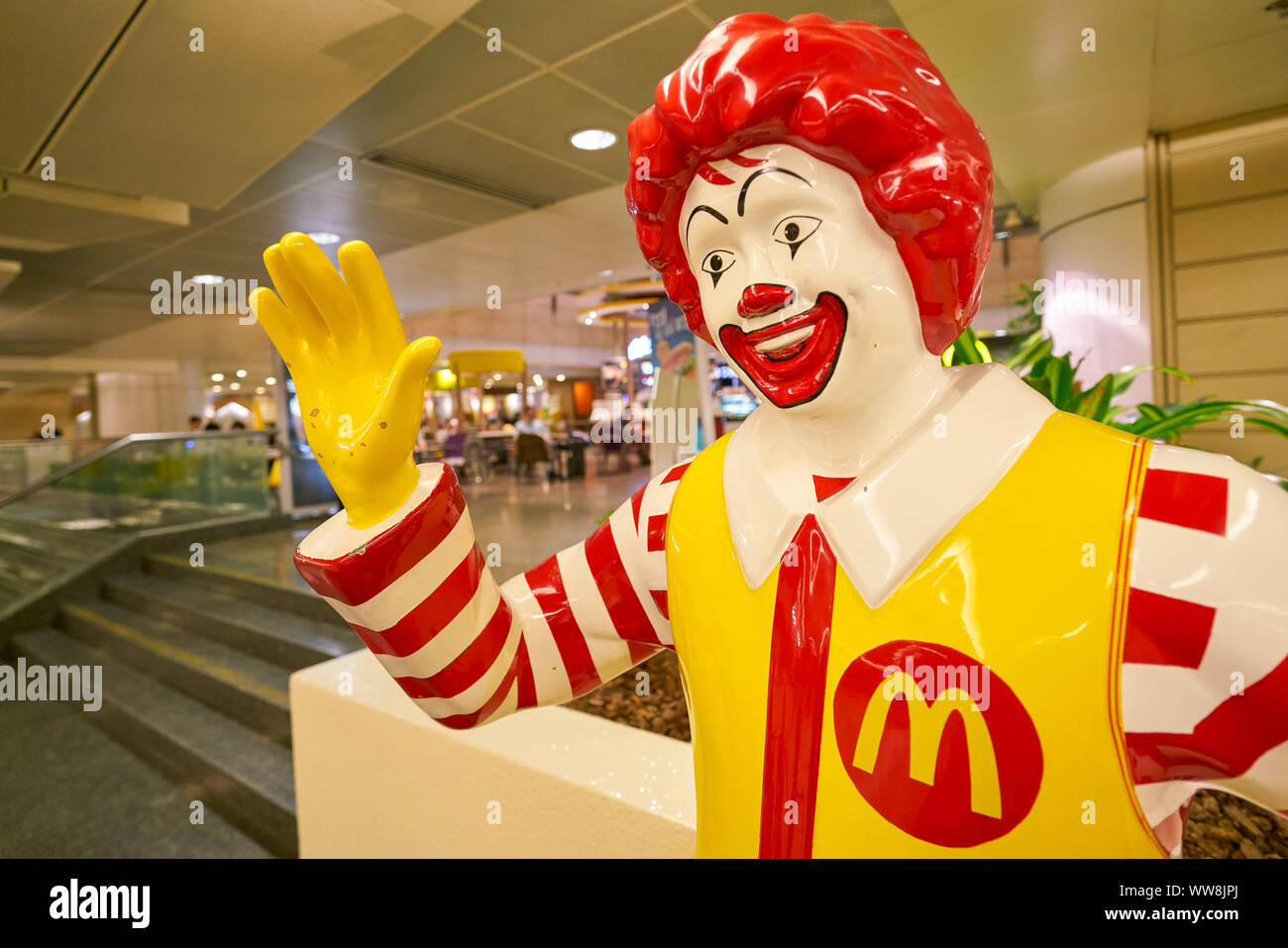 SINGAPORE - CIRCA APRIL, 2019: Ronald McDonald statue in greeting guests at Changi International Airport. Stock Photo