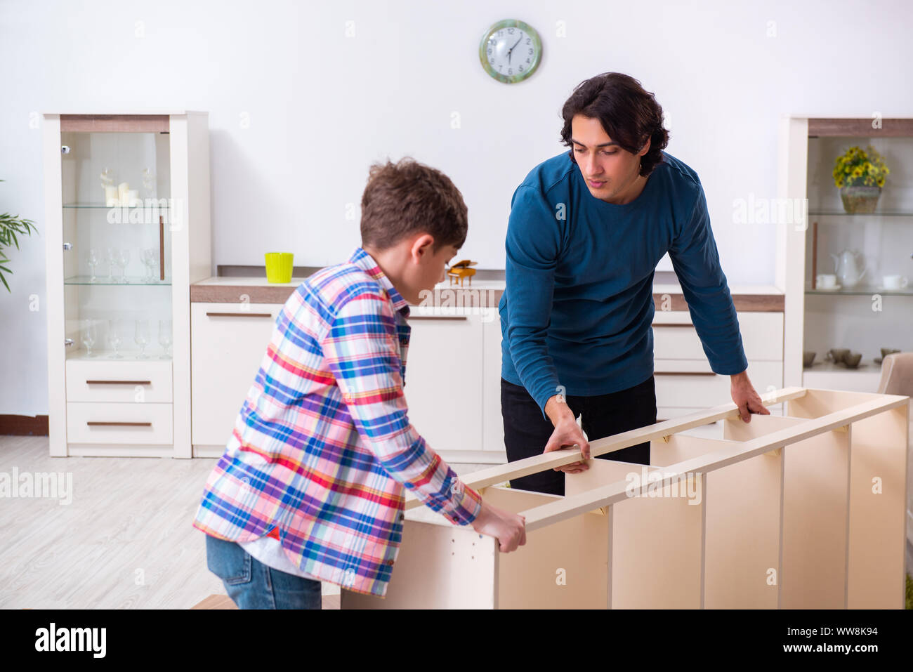 The young carpenter teaching his son Stock Photo - Alamy