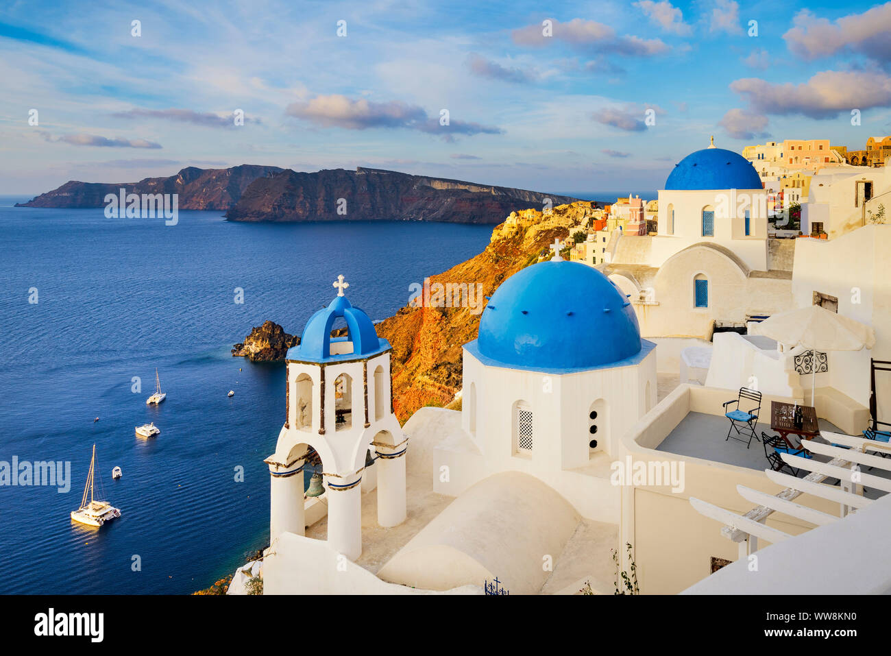 Oia town on Santorini island, Greece with traditional buildings with blue domes Stock Photo