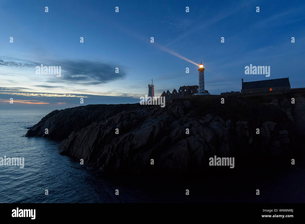 Lighthouse in the evening with beacon, Saint Mathieu lighthouse, Pointe ...