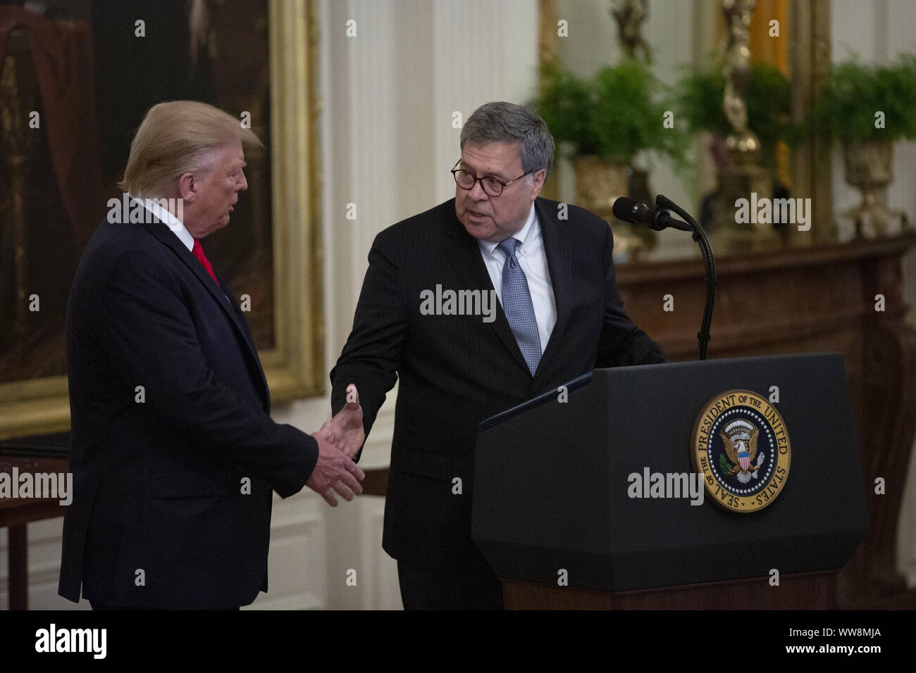 September 9, 2019, Washington, District of Columbia, USA: United States Attorney General William P. Barr shakes hands with United States President Donald J. Trump prior to awarding the Medal of Valor to members of the Dayton Police Department and Heroic Commendations to five civilians from El Paso, Texas in an East Room ceremony at the White House in Washington D.C., U.S. on September 9, 2019.  ..Credit: Stefani Reynolds / CNP/AdMedia (Credit Image: © Stefani Reynolds/AdMedia via ZUMA Wire) Stock Photo