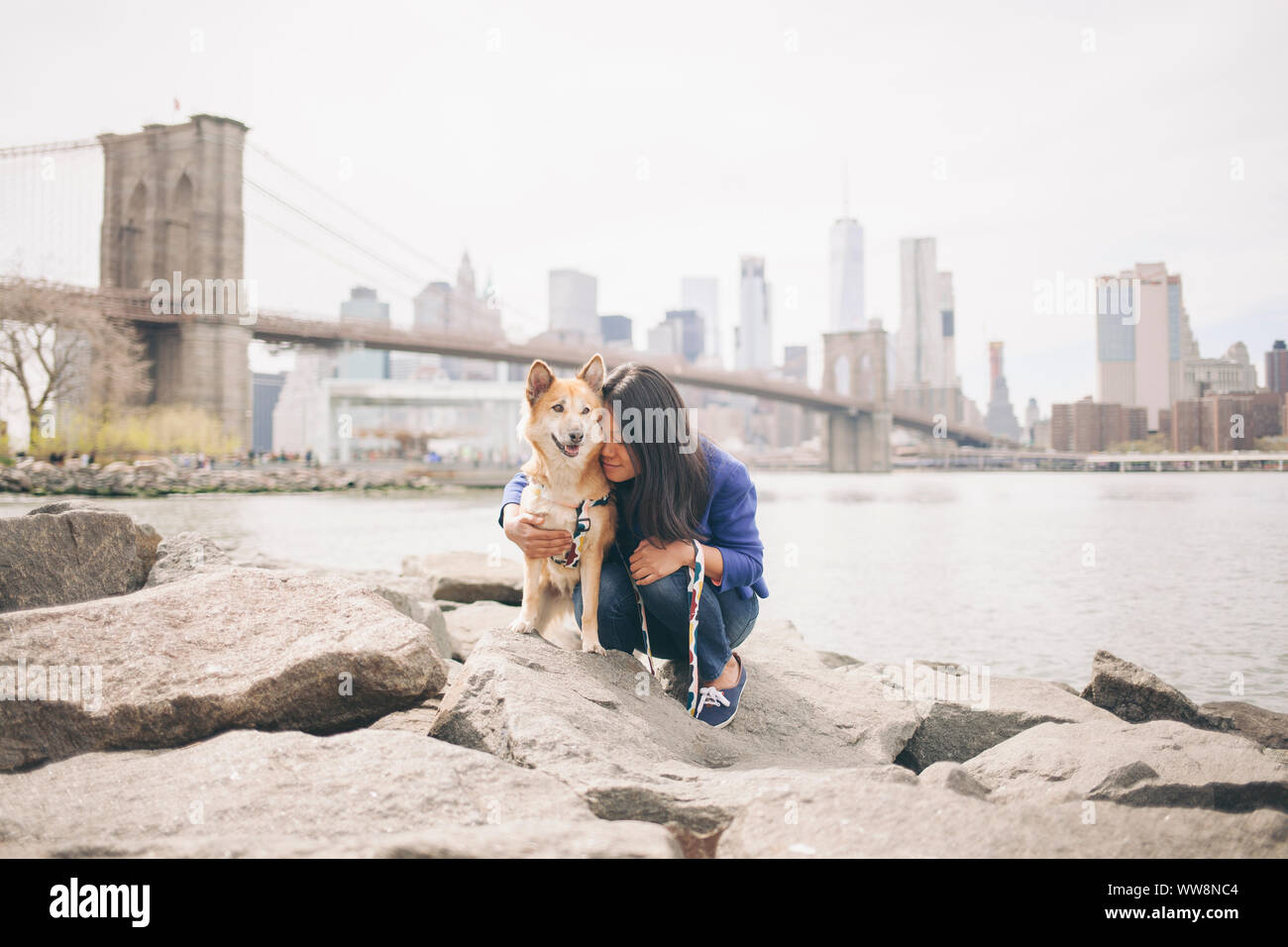 dog mom hugging her rescued dog Stock Photo