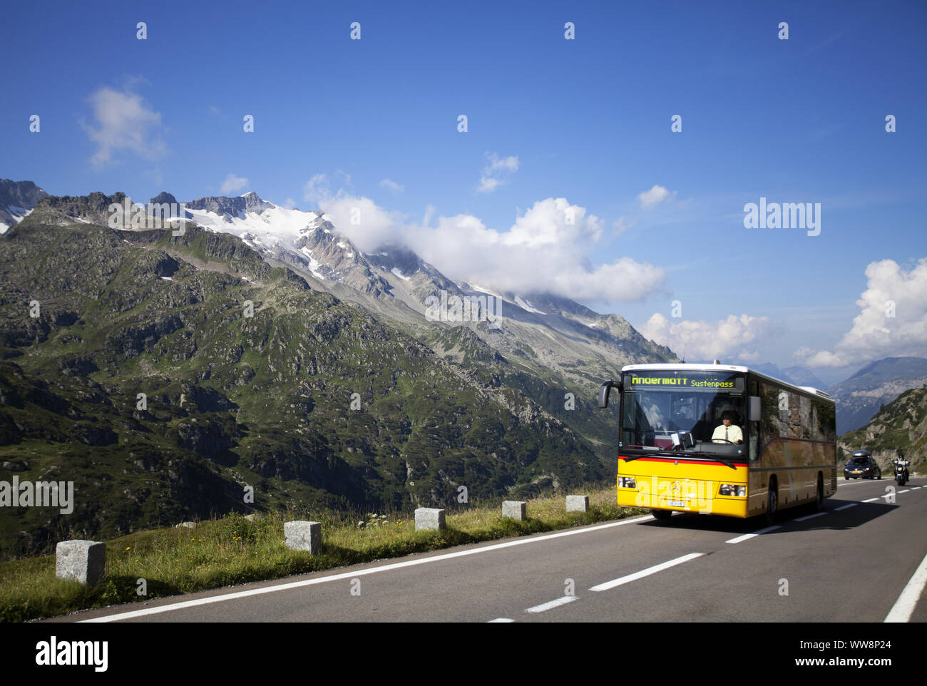 Swiss PostBus bus on Susten Mountain Pass Road, Uri Alps, Canton of Bern, Switzerland Stock Photo