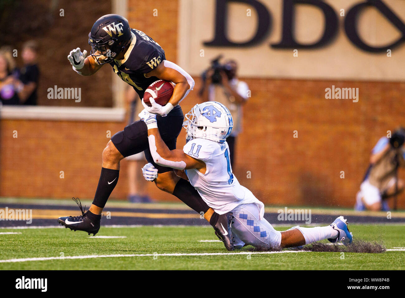 Winston-Salem, NC, USA. 13th Sep, 2019. Wake Forest Demon Deacons wide  receiver Sage Surratt (14) makes the catch and goes fifty yards for the  touchdown drawing North Carolina Tar Heels defensive back